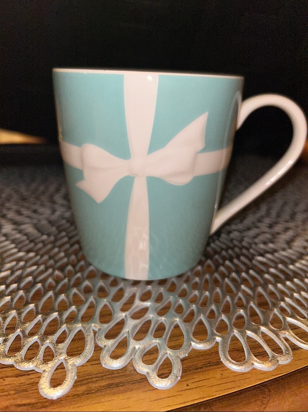 Tiffany & Co. Blue Ribbon porcelain mug featuring a white embossed bow design